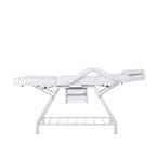 Poltrona estetica, rivestita in PVC colore bianco.